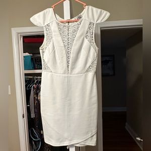 White dress with cut out pattern